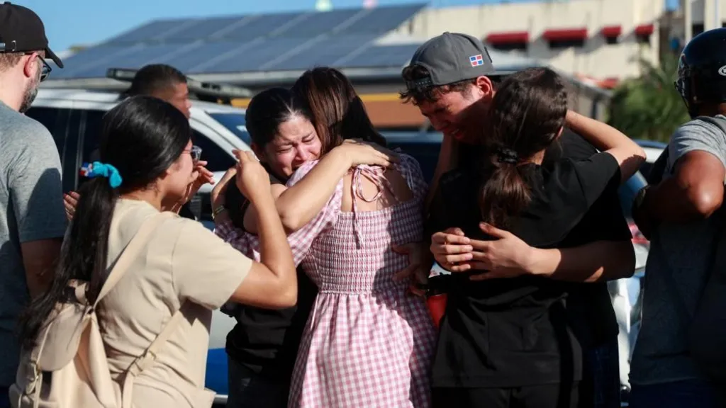 Dominican Republic nightclub collapse kills 98 2 People cry and hug each other near the Jet Set dominican nightclub in Santo Domingo
