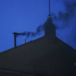 Black smoke rises from the Sistine Chapel as cardinals cast an unsuccessful first vote