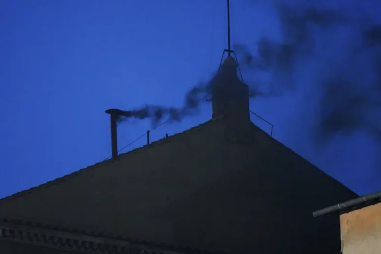 Black smoke rises from the Sistine Chapel as cardinals cast an unsuccessful first vote