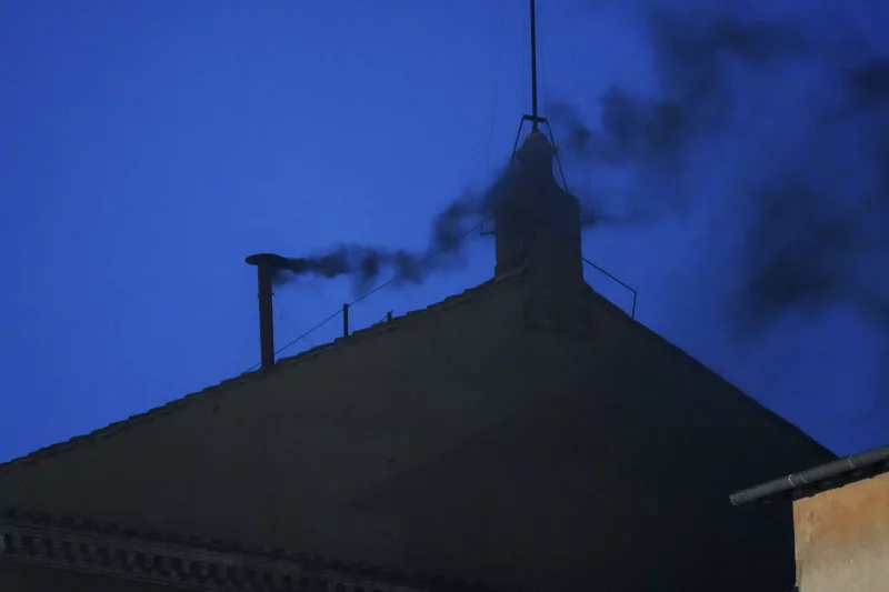 Black smoke rises from the Sistine Chapel as cardinals cast an unsuccessful first vote