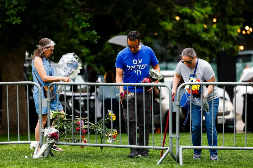 Placing flowers on Monday to honor the victims, at the attack site, a pedestrian downtown street filled with restaurants and shops. American Jews